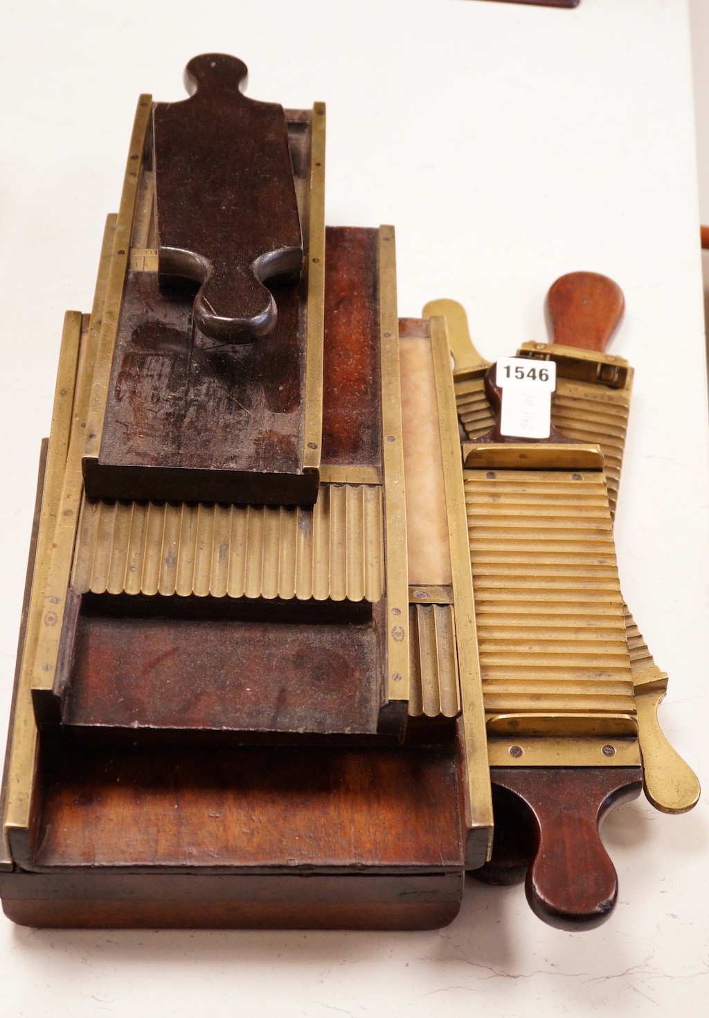 A collection of 19th century brass and mahogany chemist’s pill press rollers, Drury Lane marked examples etc